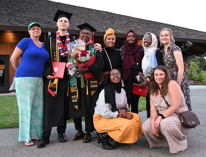 Group of graduates with family and friends