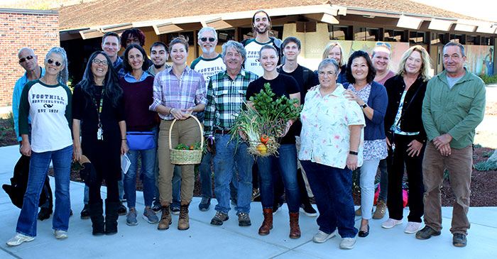 Group of students with baskets of vegetables