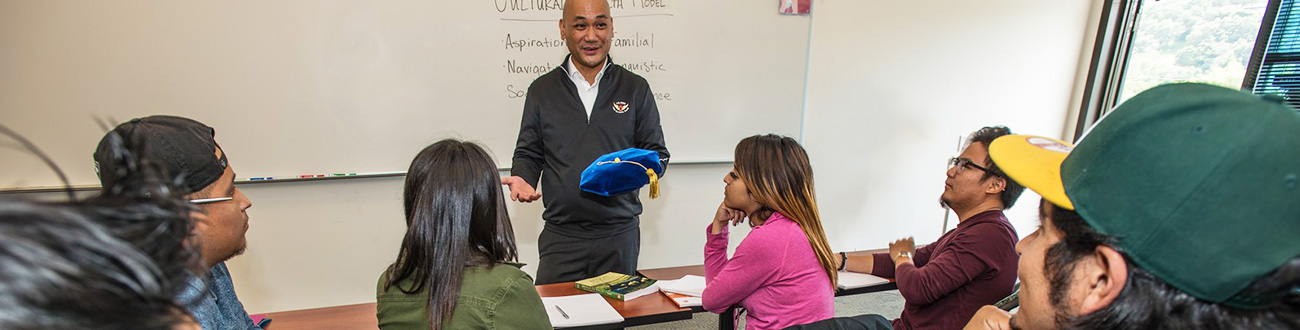 Instructor talking with students