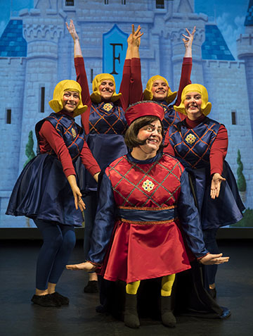 Lord Farquaad and four performers in a stage production of Shrek The Musical.
